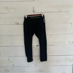 Black TEN THOUSAND 3/4 length leggings. Size medium 30-32W.